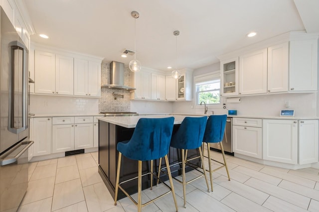 2033 Waltoffer Ave, North Bellmore, NY 11710 - kitchen with wall chimney exhaust hood, appliances with stainless steel finishes, white cabinetry, light countertops, and recessed lighting