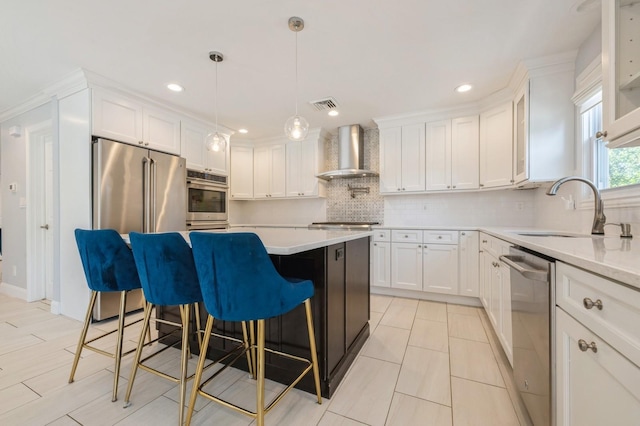 2033 Waltoffer Ave, North Bellmore, NY 11710 - kitchen featuring wall chimney range hood, appliances with stainless steel finishes, a sink, decorative backsplash, and light countertops
