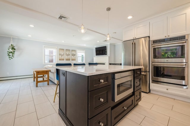 2033 Waltoffer Ave, North Bellmore, NY 11710 - kitchen with appliances with stainless steel finishes, white cabinetry, a baseboard heating unit, light countertops, and crown molding