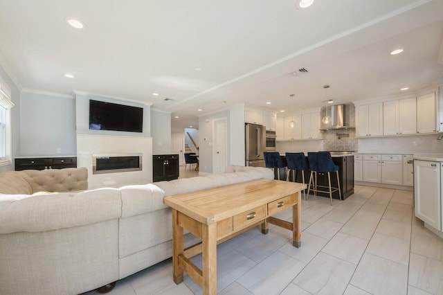 2033 Waltoffer Ave, North Bellmore, NY 11710 - living area featuring stairs, crown molding, recessed lighting, a glass covered fireplace, and light tile patterned floors