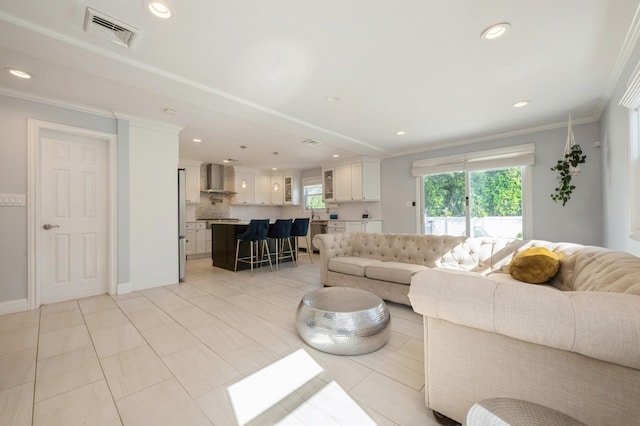 2033 Waltoffer Ave, North Bellmore, NY 11710 - living area featuring recessed lighting, crown molding, light tile patterned flooring, and baseboards