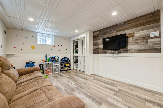 2033 Waltoffer Ave, North Bellmore, NY 11710 - living area with wooden walls, recessed lighting, an ornate ceiling, and wood finished floors