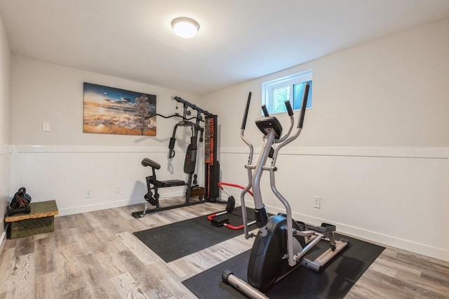 2033 Waltoffer Ave, North Bellmore, NY 11710 - exercise room featuring wood finished floors and baseboards