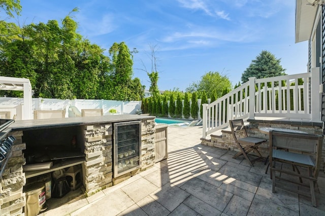 2033 Waltoffer Ave, North Bellmore, NY 11710 - view of patio / terrace featuring wine cooler