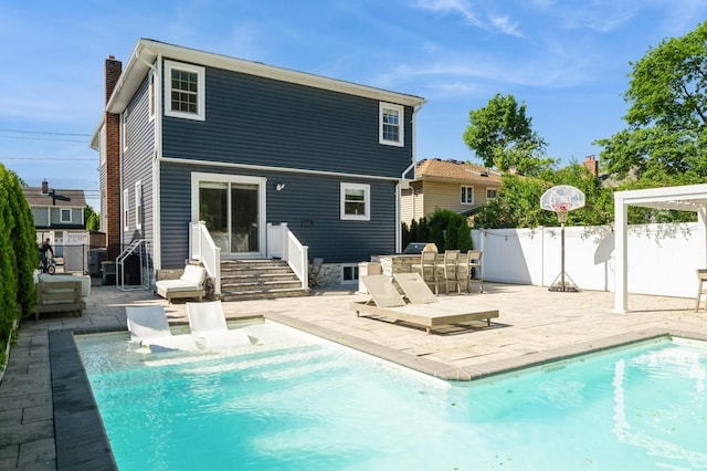 2033 Waltoffer Ave, North Bellmore, NY 11710 - rear view of house with a chimney and a patio