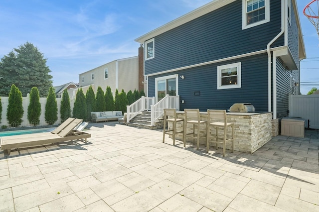 2033 Waltoffer Ave, North Bellmore, NY 11710 - view of patio featuring an outdoor kitchen
