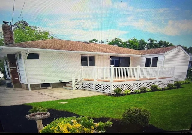50 Mills Pond Rd, Saint James, NY 11780 - rear view of property with a chimney, a lawn, and a deck