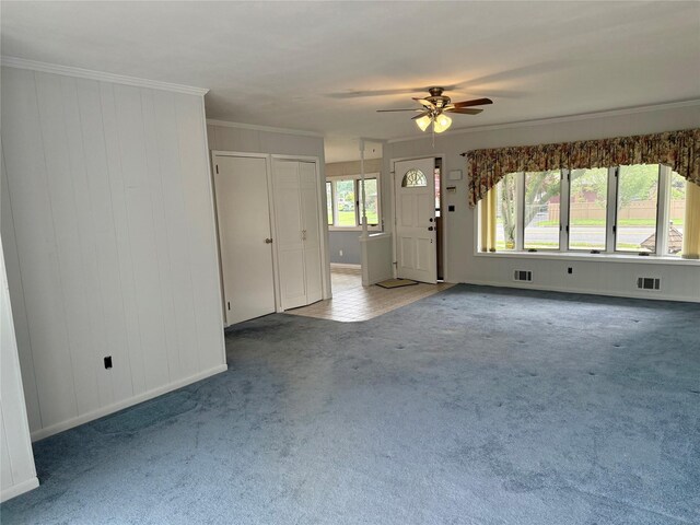 50 Mills Pond Rd, Saint James, NY 11780 - unfurnished living room with carpet, ceiling fan, crown molding, and baseboards