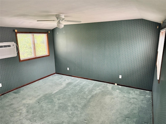 50 Mills Pond Rd, Saint James, NY 11780 - carpeted spare room with a ceiling fan, lofted ceiling, an AC wall unit, and wallpapered walls