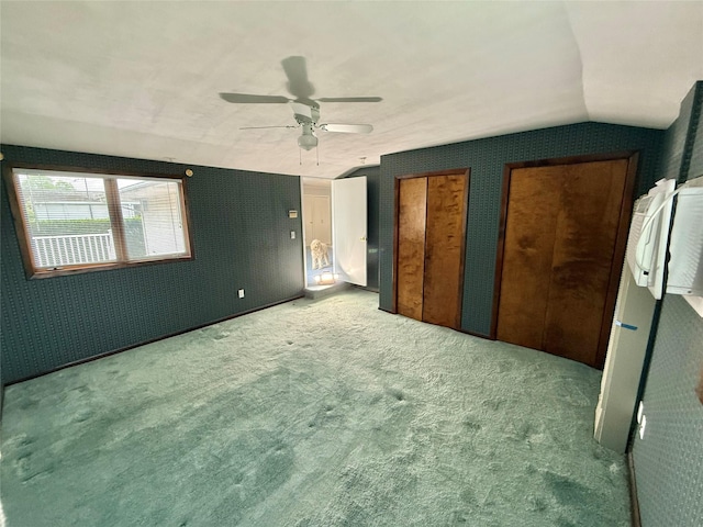 50 Mills Pond Rd, Saint James, NY 11780 - unfurnished bedroom featuring carpet floors, lofted ceiling, multiple closets, and a ceiling fan