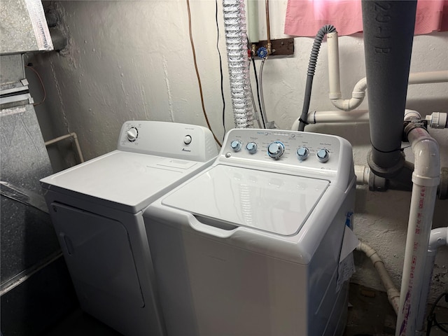 50 Mills Pond Rd, Saint James, NY 11780 - washroom featuring washing machine and clothes dryer and a textured wall