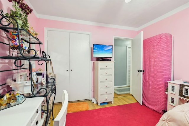 1213 E Broadway Unit B25, Hewlett, NY 11557 - bedroom featuring light wood finished floors, a closet, and ornamental molding