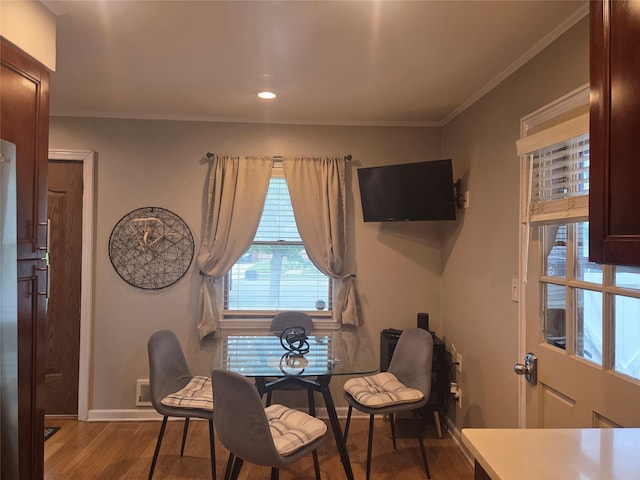 980 Alhambra Rd, North Baldwin, NY 11510 - dining area with wood finished floors, crown molding, baseboards, and recessed lighting