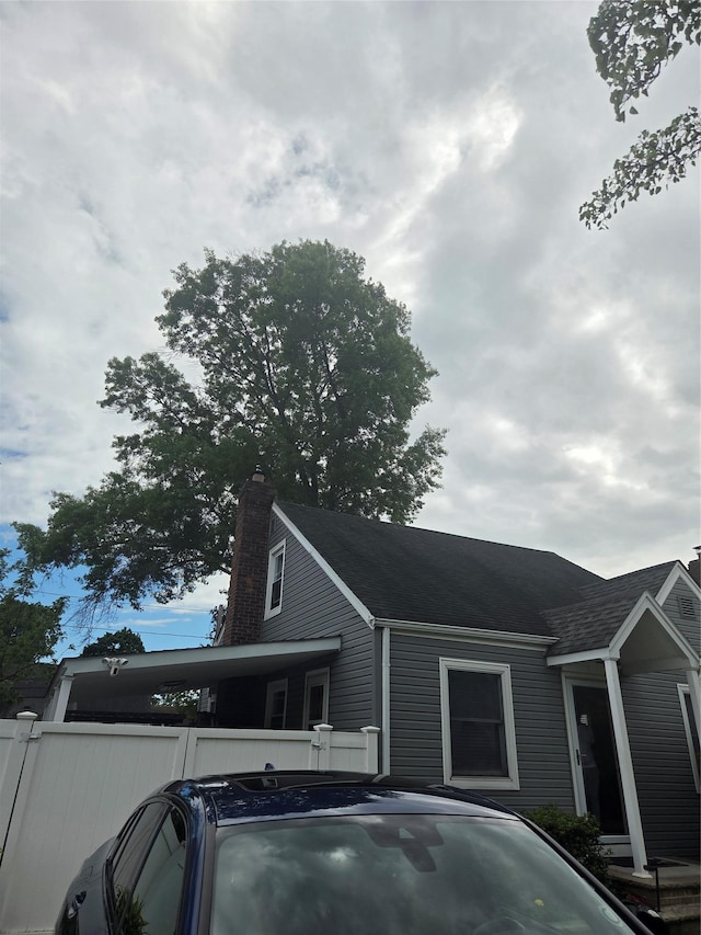 980 Alhambra Rd, North Baldwin, NY 11510 - view of side of property with a chimney