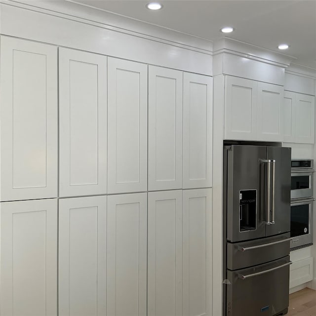 26 Rodina Dr, Pawling, NY 12564 - kitchen with stainless steel appliances, white cabinetry, and recessed lighting