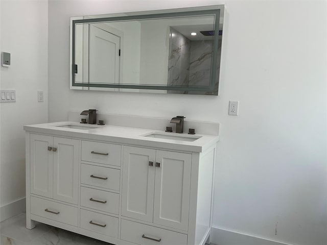 26 Rodina Dr, Pawling, NY 12564 - full bathroom featuring marble look tile flooring, double vanity, baseboards, and a shower