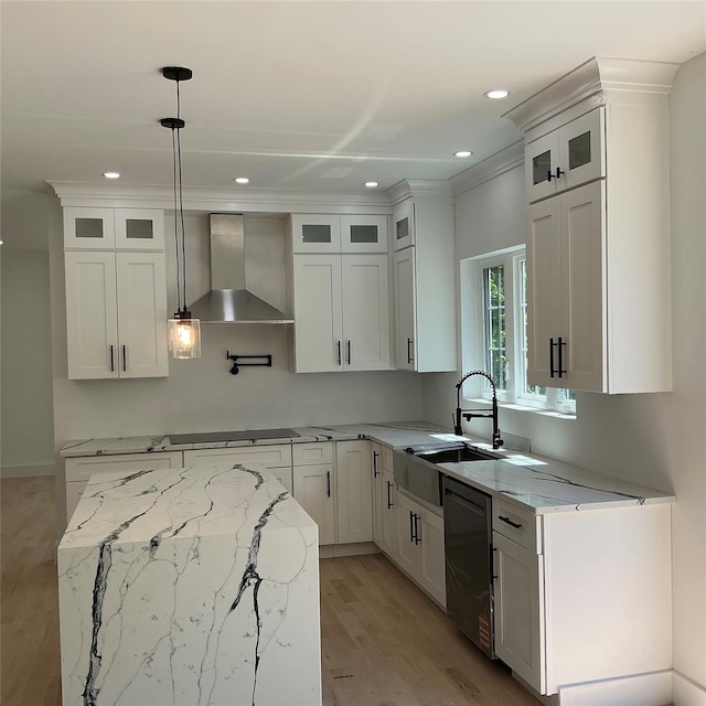 26 Rodina Dr, Pawling, NY 12564 - kitchen with wall chimney range hood, a sink, cooktop, light wood-style flooring, and light stone counters