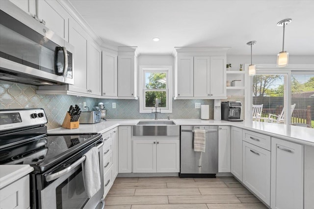 8 Meyer Ln, Medford, NY 11763 - kitchen with appliances with stainless steel finishes, a sink, light countertops, and recessed lighting