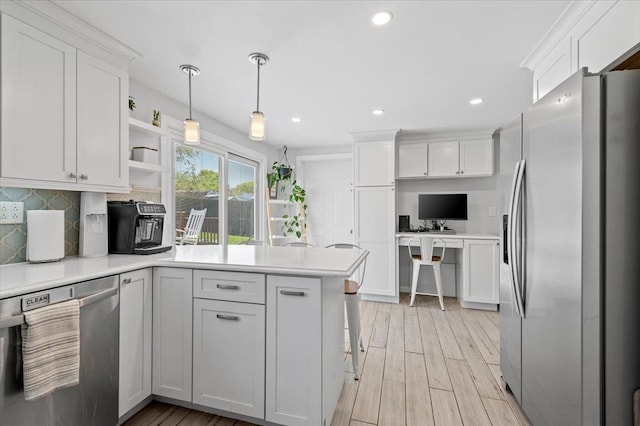 8 Meyer Ln, Medford, NY 11763 - kitchen with appliances with stainless steel finishes, a peninsula, tasteful backsplash, white cabinetry, and open shelves