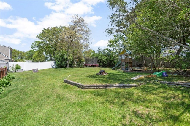8 Meyer Ln, Medford, NY 11763 - view of yard featuring a trampoline and a playground