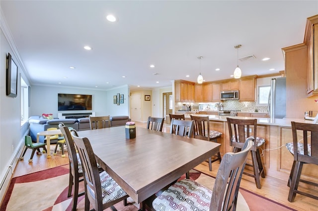 29 Cross Bow Ln, Commack, NY 11725 - dining room with crown molding, recessed lighting, and light wood finished floors