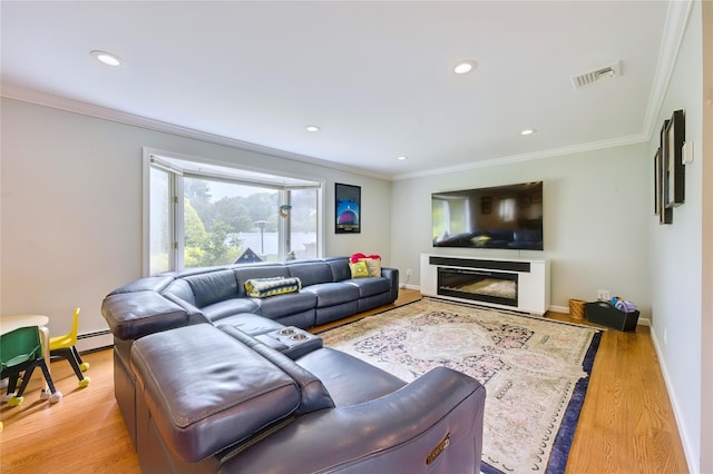 29 Cross Bow Ln, Commack, NY 11725 - living area with crown molding, light wood-style floors, recessed lighting, baseboards, and a glass covered fireplace