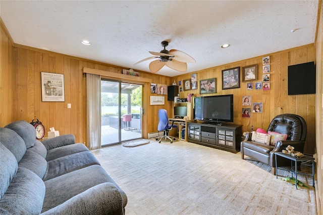 29 Cross Bow Ln, Commack, NY 11725 - carpeted living area with wooden walls, ceiling fan, a baseboard heating unit, recessed lighting, and a textured ceiling