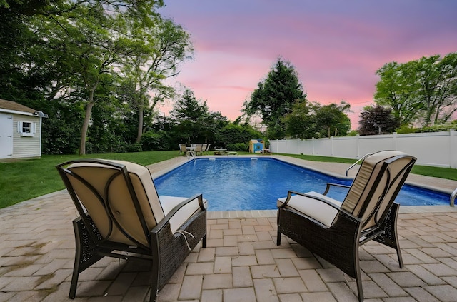 29 Cross Bow Ln, Commack, NY 11725 - pool at dusk with a patio and an outbuilding