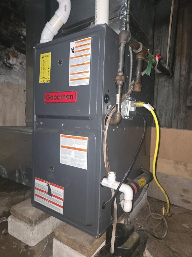 utility room with heating unit