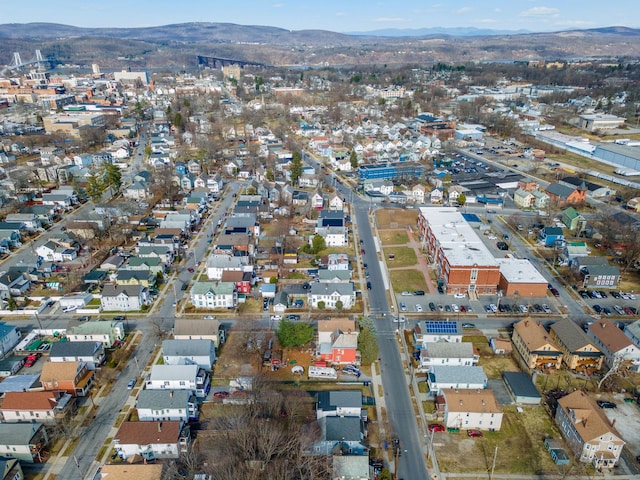 aerial view of property and surrounding area with a mountainous background