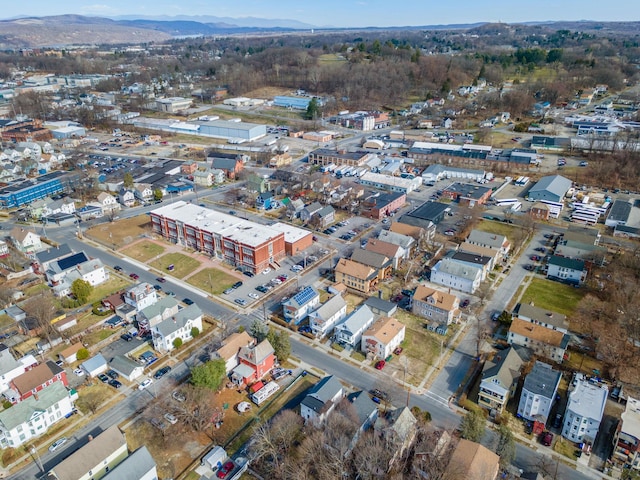 aerial view of property and surrounding area featuring mountains