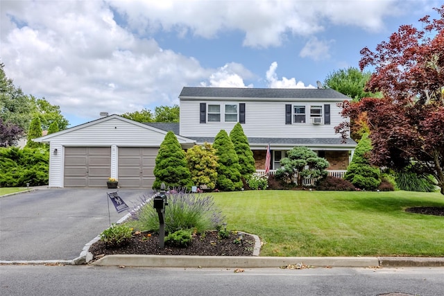 17 Daytona Beach Pl, Coram, NY 11727 - traditional-style house with asphalt driveway, an attached garage, and a front lawn