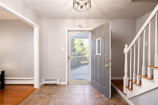 17 Daytona Beach Pl, Coram, NY 11727 - foyer entrance with a baseboard heating unit, stairway, baseboards, and tile patterned floors