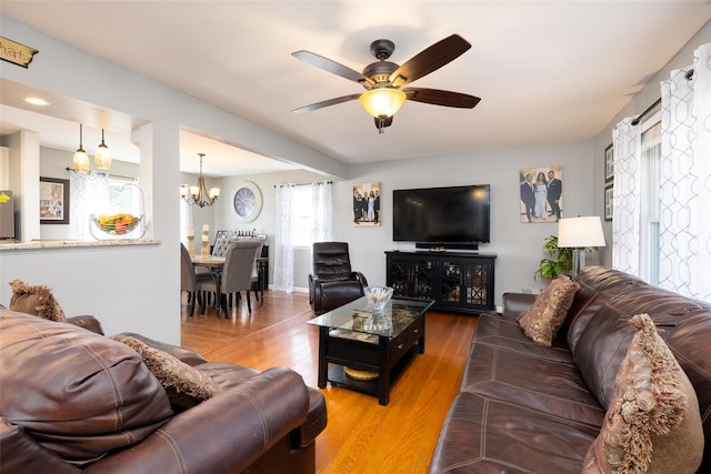 17 Daytona Beach Pl, Coram, NY 11727 - living area featuring a chandelier, ceiling fan, and wood finished floors