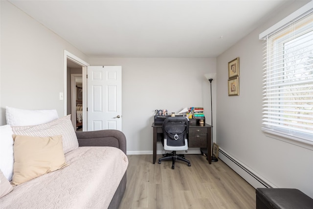 17 Daytona Beach Pl, Coram, NY 11727 - bedroom featuring multiple windows, light wood-type flooring, and a baseboard heating unit
