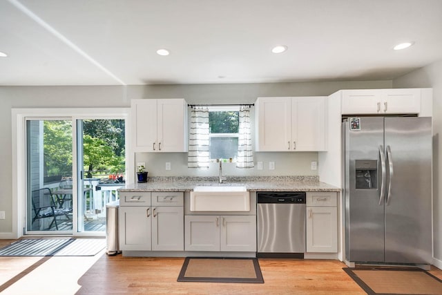 59 Middle Island Blvd, Middle Island, NY 11953 - kitchen with appliances with stainless steel finishes, a sink, plenty of natural light, light wood-type flooring, and recessed lighting