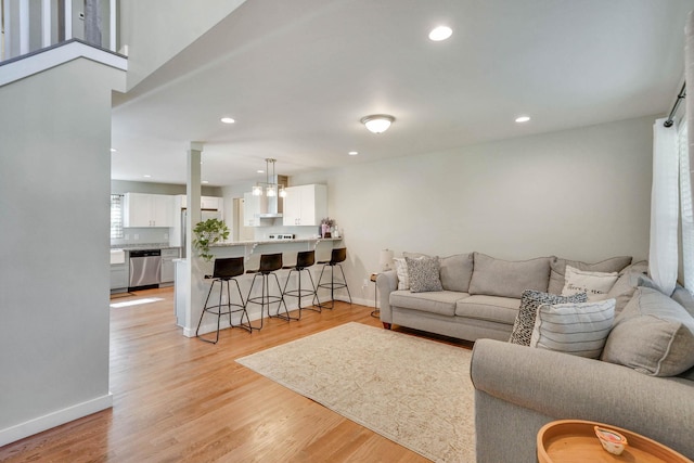 59 Middle Island Blvd, Middle Island, NY 11953 - living room featuring baseboards, recessed lighting, and light wood-style flooring