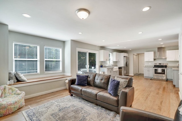 59 Middle Island Blvd, Middle Island, NY 11953 - living room featuring light wood finished floors, baseboards, and recessed lighting