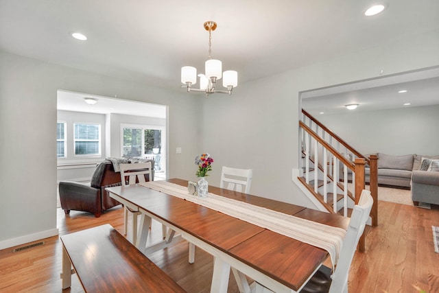 59 Middle Island Blvd, Middle Island, NY 11953 - dining room featuring a chandelier, light wood finished floors, recessed lighting, stairs, and baseboards