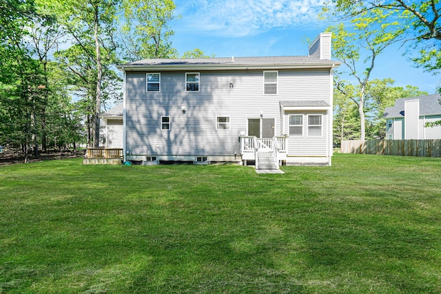 59 Middle Island Blvd, Middle Island, NY 11953 - back of property with a chimney and a deck
