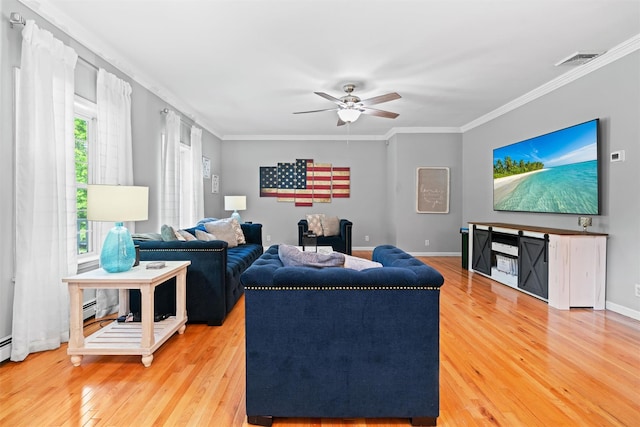 8 Roosa Rd, Wallkill, NY 12589 - living room with wood finished floors, crown molding, ceiling fan, baseboards, and a baseboard heating unit