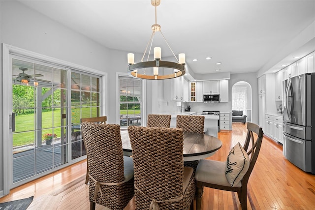 8 Roosa Rd, Wallkill, NY 12589 - dining area with arched walkways, a chandelier, light wood-style floors, and recessed lighting