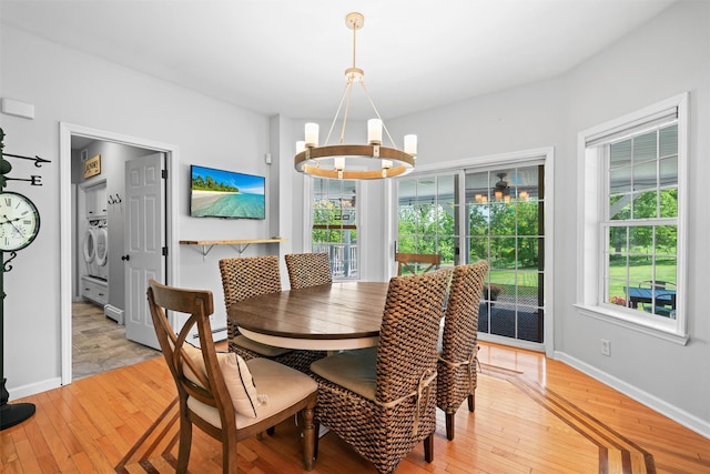 8 Roosa Rd, Wallkill, NY 12589 - dining space featuring a chandelier, light wood-type flooring, and baseboards