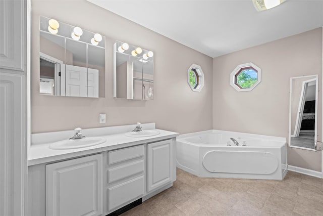 8 Roosa Rd, Wallkill, NY 12589 - full bath with double vanity, a bath, and baseboards