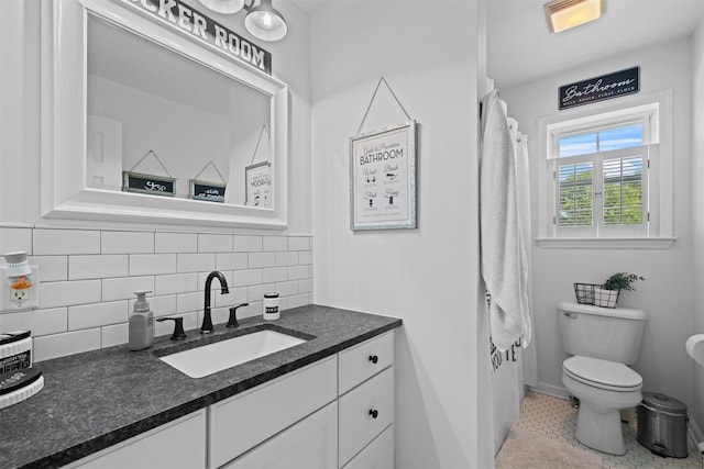 8 Roosa Rd, Wallkill, NY 12589 - bathroom with vanity, toilet, and tasteful backsplash