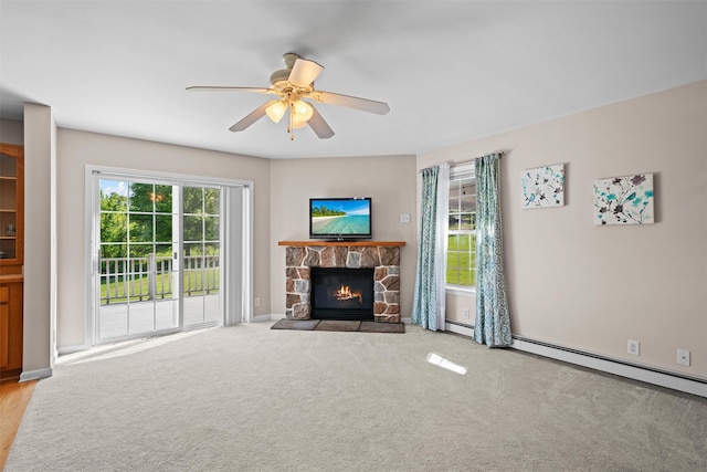 8 Roosa Rd, Wallkill, NY 12589 - unfurnished living room with healthy amount of natural light, ceiling fan, a stone fireplace, and carpet floors