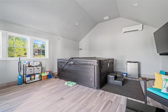 8 Roosa Rd, Wallkill, NY 12589 - bedroom featuring vaulted ceiling, a wall mounted air conditioner, and wood finished floors