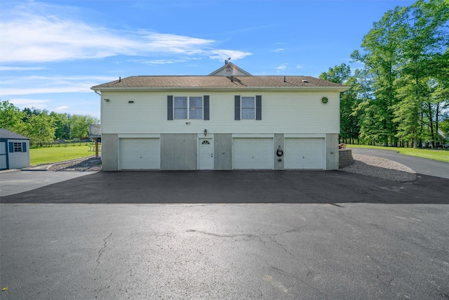 8 Roosa Rd, Wallkill, NY 12589 - rear view of property with a garage and asphalt driveway