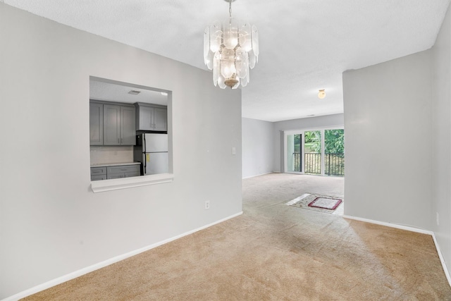 32 Huntington Cir Building 19, Peekskill, NY 10566 - carpeted empty room featuring a chandelier and baseboards
