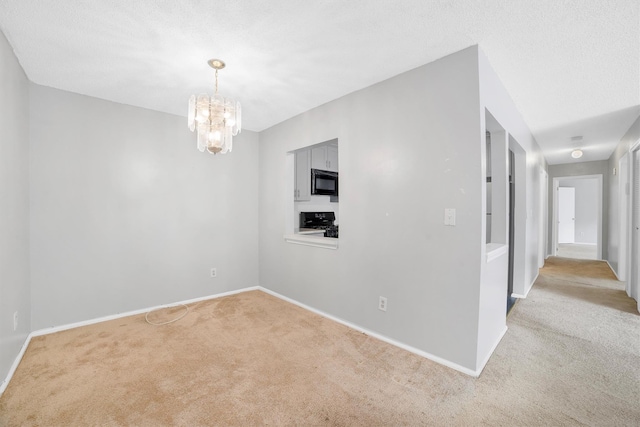32 Huntington Cir Building 19, Peekskill, NY 10566 - carpeted empty room with a chandelier and baseboards